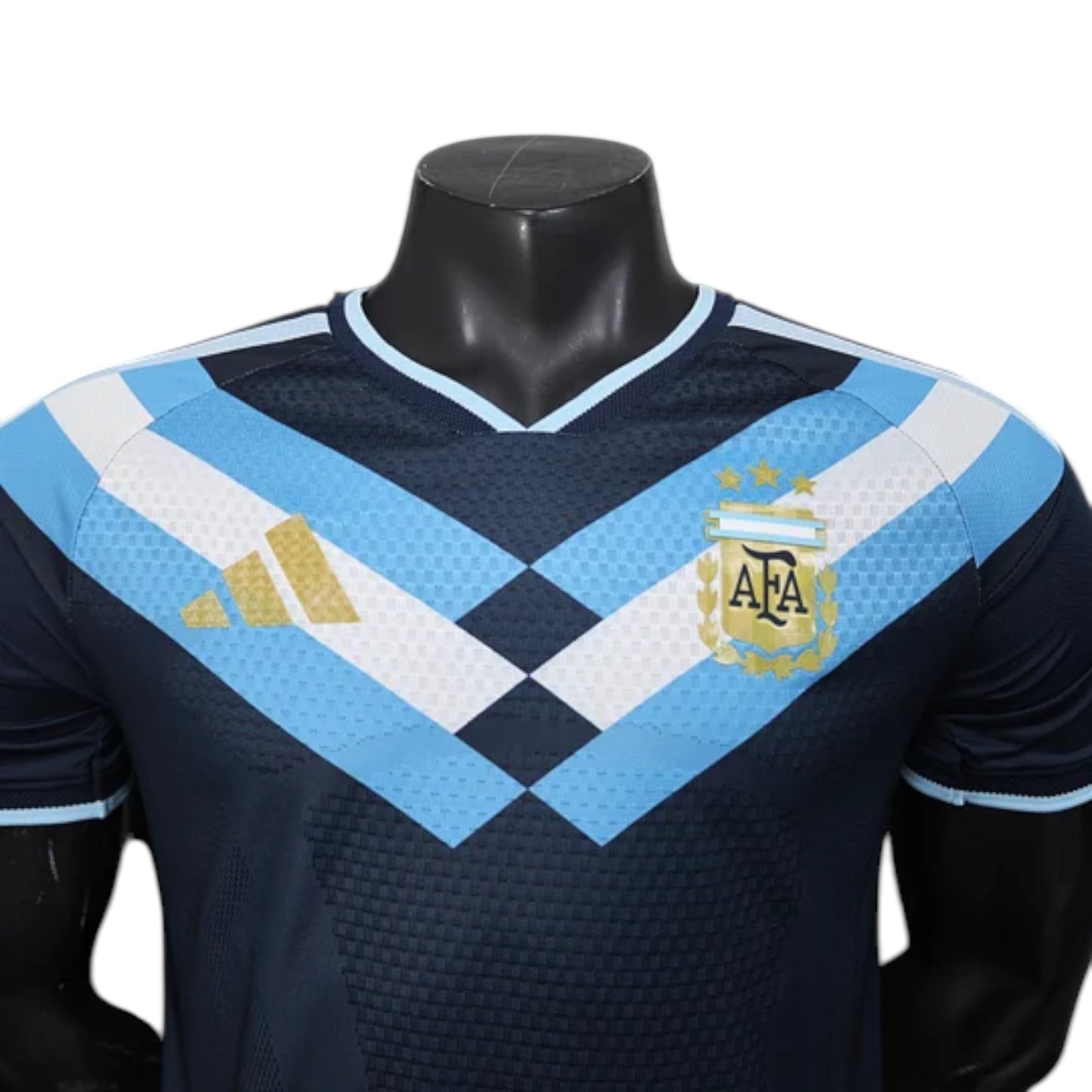 GOATkitz Argentina 2026 player version black football jersey with light blue and white chevron design and gold Adidas logo.