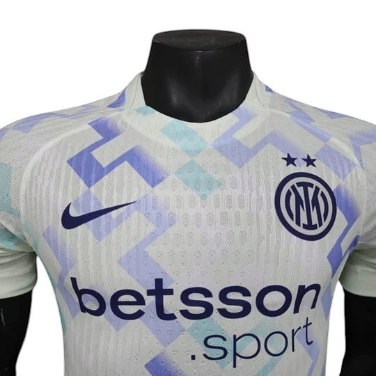 GOATkitz Inter Milan 2025-26 away jersey in white with blue and light blue geometric pattern. Features Nike logo and Inter crest.