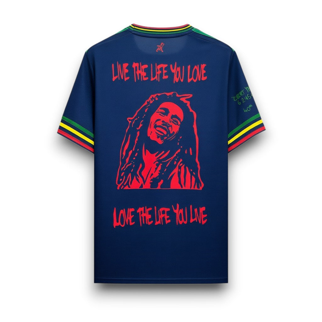 GOATkitz navy blue jersey with Bob Marley graphic and "Live the life you love" text. Features red, yellow, and green striped cuffs and collar.
