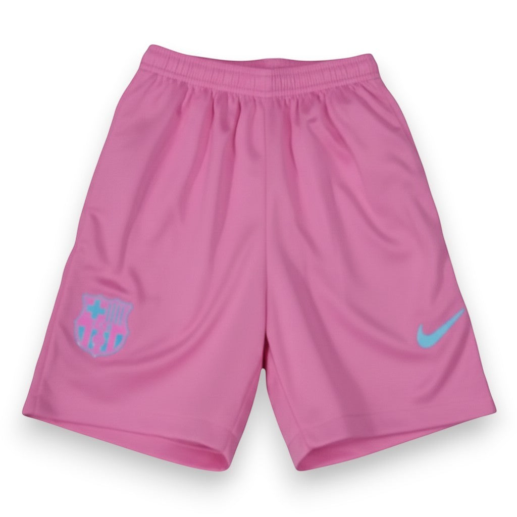 GOATkitz Barcelona pink concept kids shorts with light blue FC Barcelona crest and Nike swoosh logo.