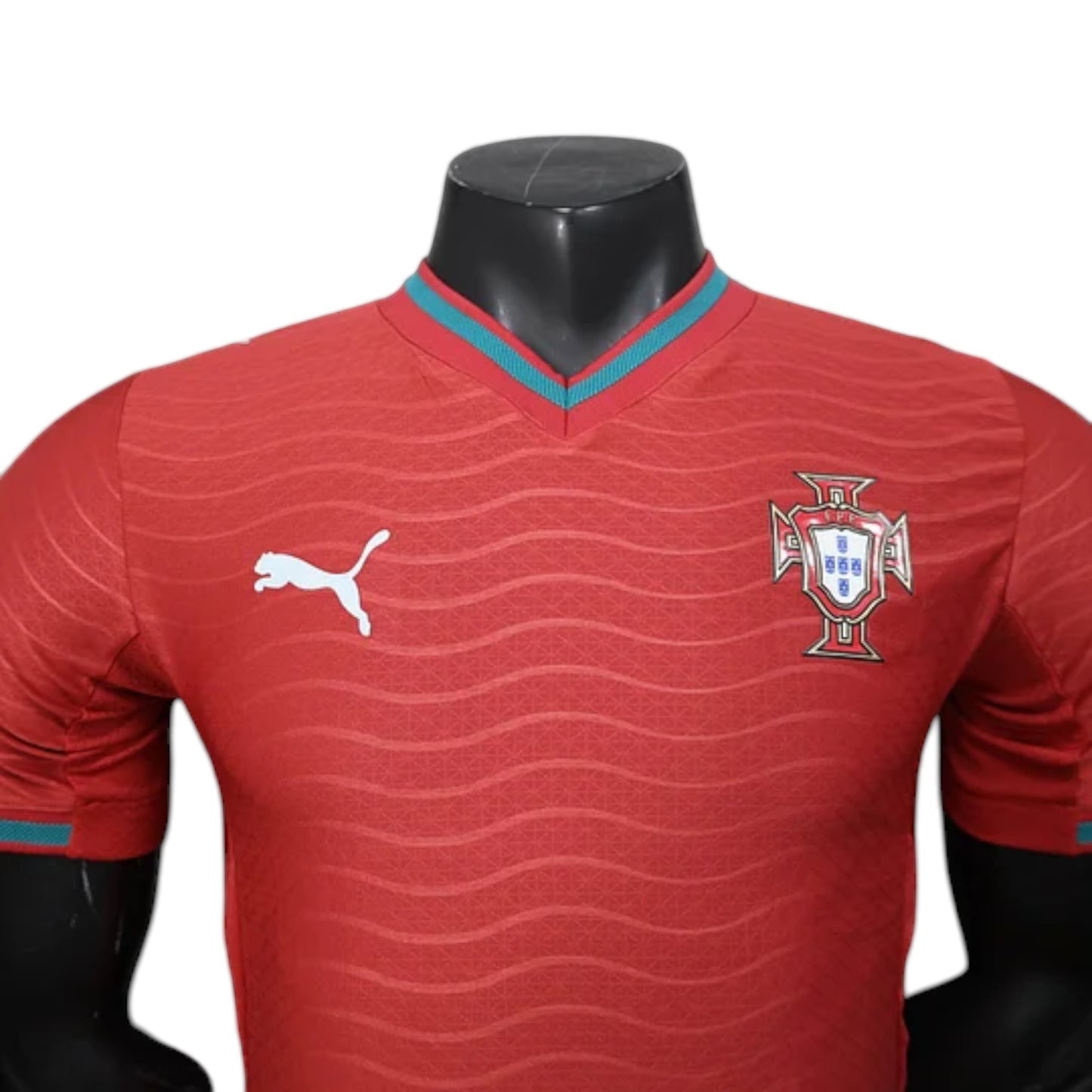 GOATkitz Portugal 2026 player version red jersey with wave pattern, teal collar trim, Puma logo, and crest.