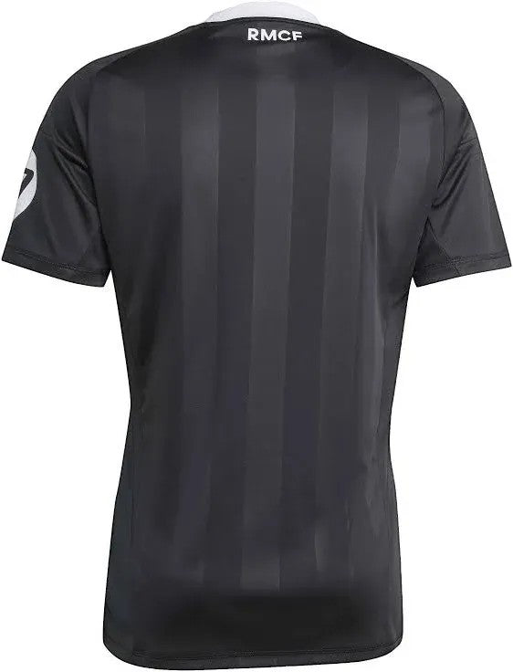 GOATkitz Real Madrid 2025-26 black goalkeeper jersey with vertical stripe pattern and white RMCF logo on collar.