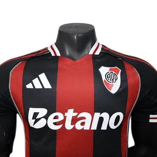 GOATkitz River Plate 2025-26 player version away jersey in black and red stripes with white Adidas logo and Betano sponsor.