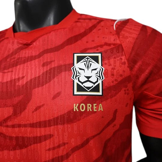 GOATkitz South Korea 2026 Player Version Home Jersey in red with a tiger stripe pattern and the national team crest.