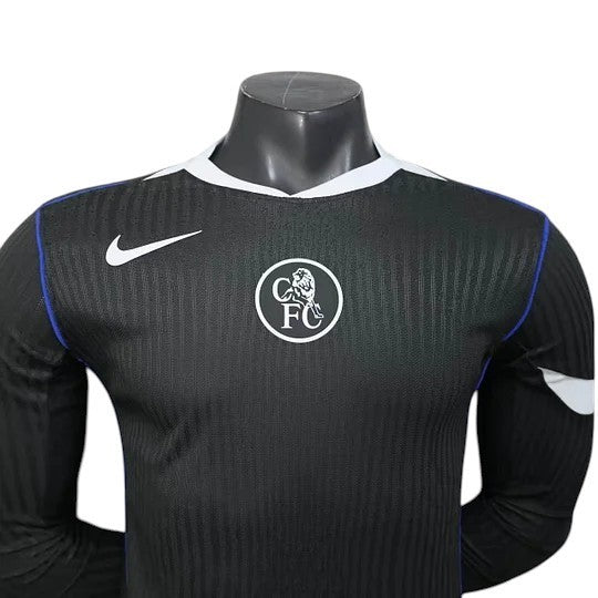 GOATkits Chelsea 2025-26 black long sleeve player version jersey with white collar and blue trim. Features CFC crest and Nike logo.