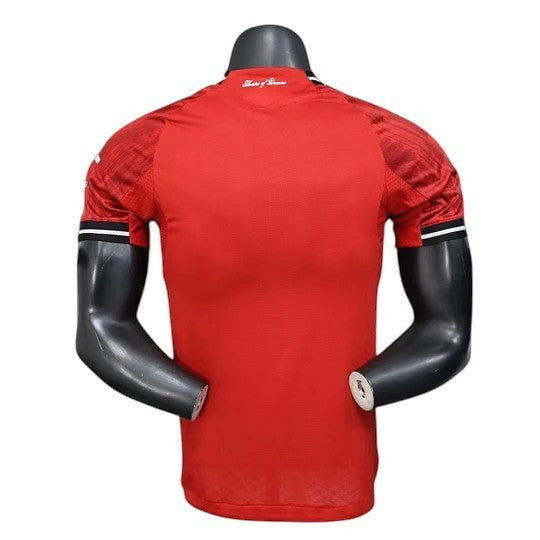 GOATkits Manchester United 2025-26 red player version football jersey with black and white striped cuffs.