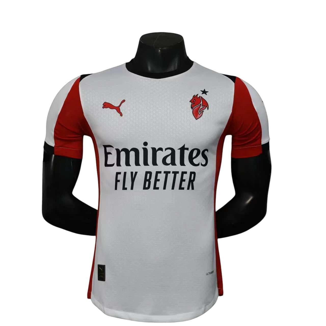 GOATkitz AC Milan 2025-26 white player version away jersey with red sleeves and Emirates Fly Better logo.