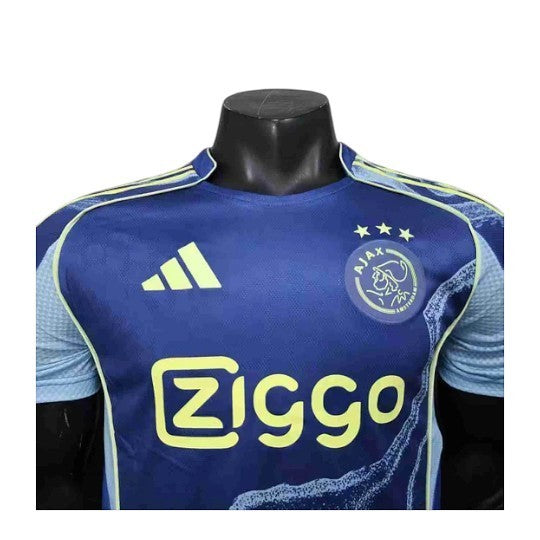 GOATkitz Ajax 2025-26 player version away jersey in navy blue with yellow accents and Ziggo sponsor.