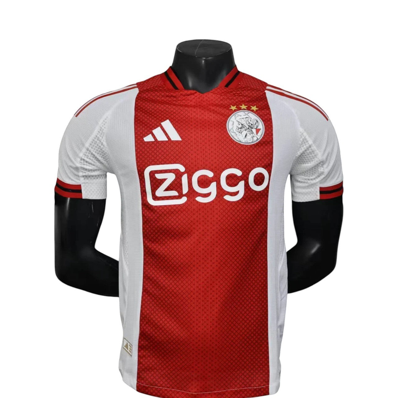 GOATkitz Ajax 2025-26 player version home jersey, red and white with Ziggo sponsor, Adidas logo, and club crest.