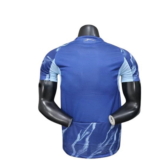 GOATkitz Ajax 2025-26 player version away jersey, blue with light blue abstract pattern on sleeves and hem.