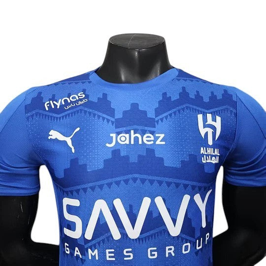 GOATkitz Al-Hilal 2025-26 player version royal blue football jersey with white logos and patterns.
