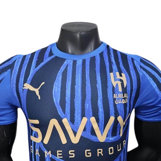 GOATkitz Al-Hilal 2025 Club World Cup player version home jersey in navy blue with blue abstract stripes, featuring Puma logo and Al-Hilal crest.
