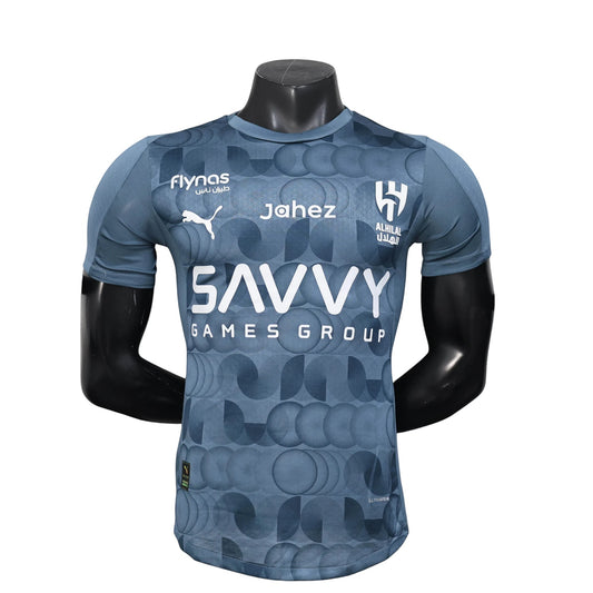 GOATkitz Al-Hilal 2025-26 player version third jersey in grey with a geometric pattern. Features sponsor logos and team crest.
