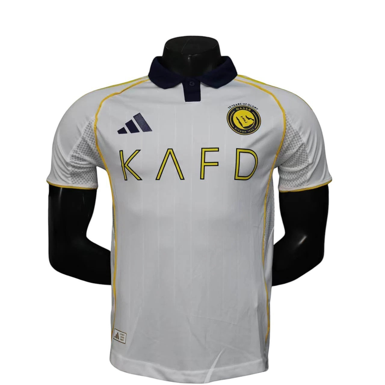 GOATkitz Al-Nassr 2025-26 white player version third jersey with navy collar and yellow trim. Features customisable name/number option.
