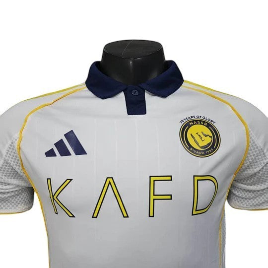 GOATkitz Al-Nassr 2025-26 white player version third jersey with navy collar and yellow trim. Features customisable name/number option.