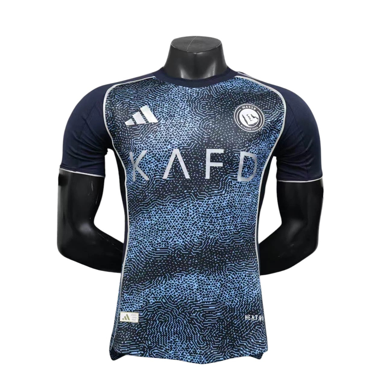 GOATkitz Al-Nassr 2025-26 player version away jersey in navy blue with light blue abstract pattern and white accents.