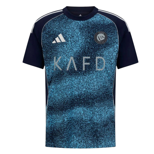 GOATkitz Al-Nassr 2025-26 away jersey in navy and light blue with a textured pattern and KAFD logo.