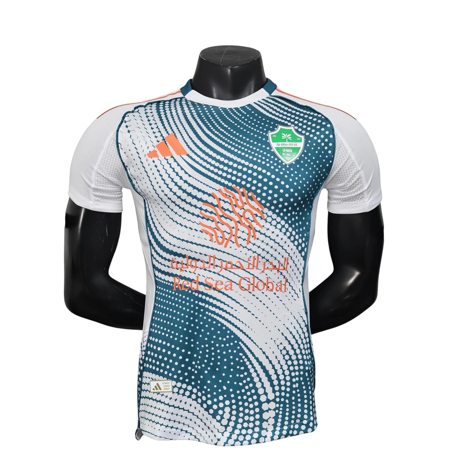 GOATkitz Al-Ahli 2025-26 player version third jersey in white, teal, and orange with a dotted pattern and Arabic text.