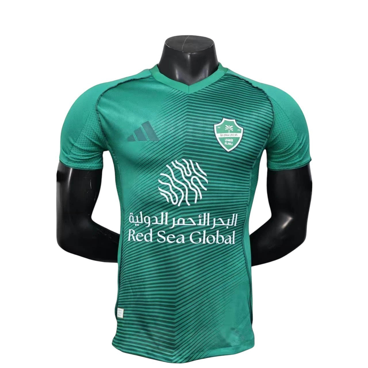 GOATkitz Al-Ahli 2025-26 player version away jersey in green with white accents and graphic pattern. Features club crest and sponsor logo.