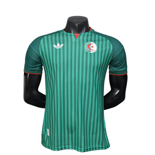GOATkitz Algeria 2026 player version away jersey in green with vertical stripes and red trim. Features Adidas logo and Algeria crest.