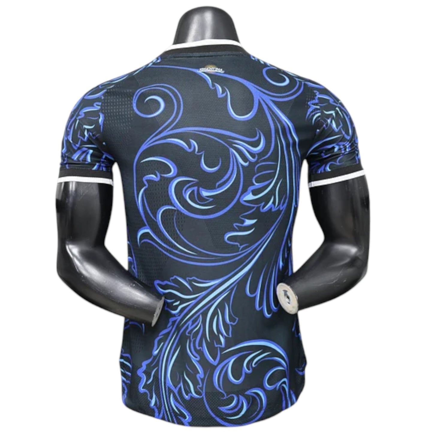 GOATkitz Argentina 2026 player version away jersey, black with blue ornate floral pattern, white trim on collar and sleeves.