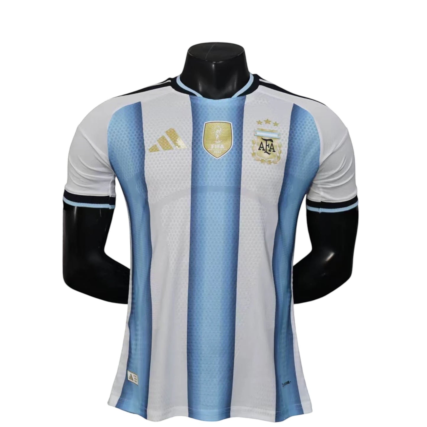 GOATkitz Argentina 2026 player version home jersey with blue and white stripes, gold accents, and FIFA badge.