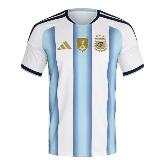 GOATkitz Argentina 2026 kids home jersey with light blue and white vertical stripes, gold Adidas logo, and FIFA World Cup badge.