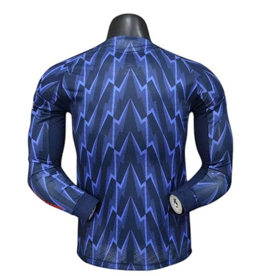 GOATkitz Arsenal 2025-26 adult player version away long sleeve jersey in navy with a blue lightning bolt pattern.