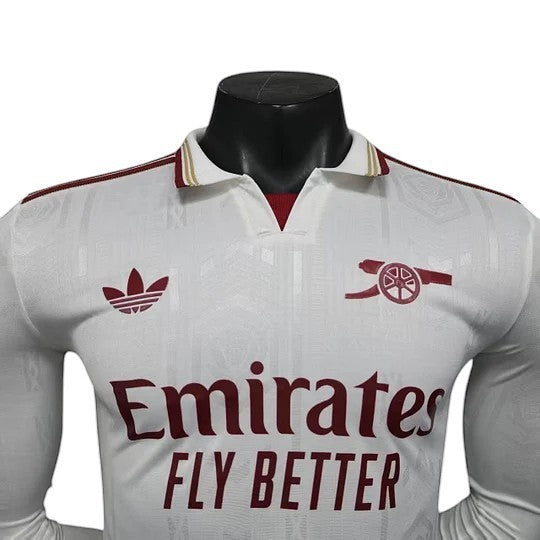 GOATkitz Arsenal 2025-26 white long sleeve player version football jersey with maroon accents and Emirates Fly Better logo.