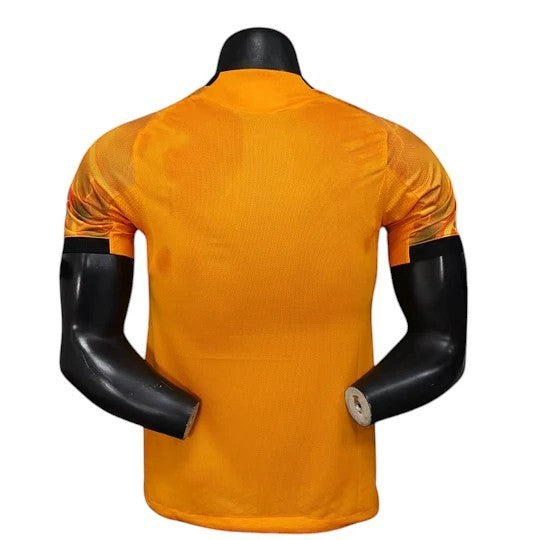 GOATKitz AS Roma 2025-26 adult player version away jersey in orange with black accents on the sleeves. Customizable.