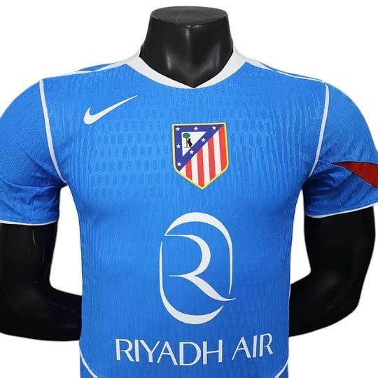 GOATkitz Atlético Madrid 2025-26 Player Version Third Jersey, blue with white trim, club crest, Nike logo, and Riyadh Air sponsor.