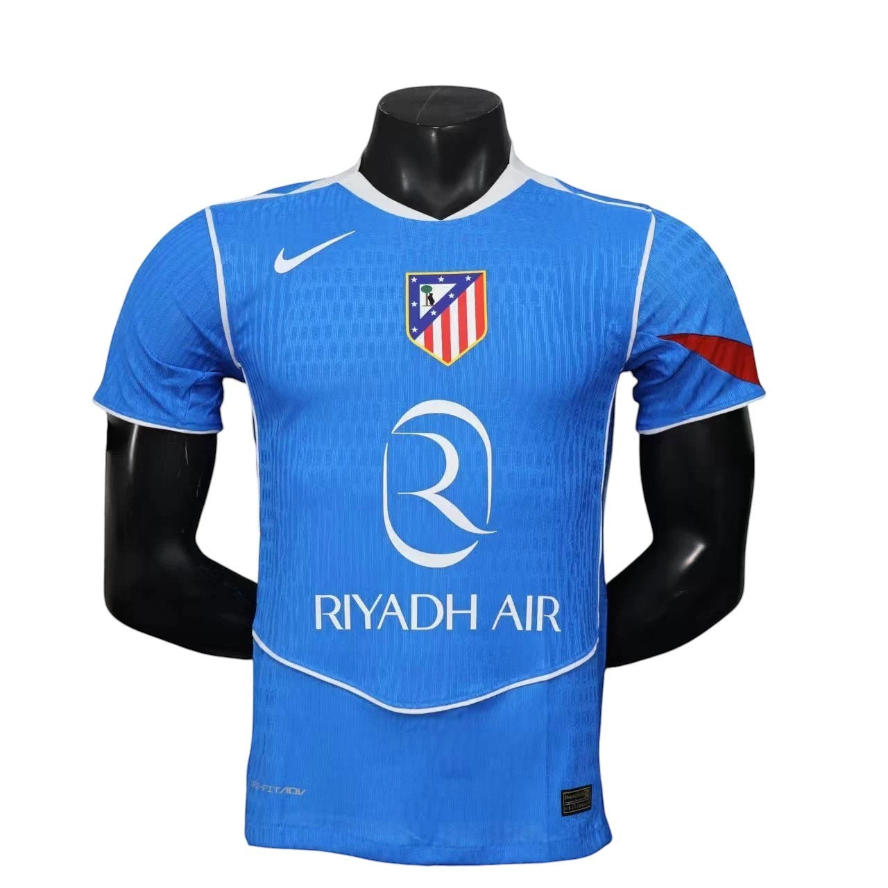 GOATkitz Atlético Madrid 2025-26 player version third jersey in blue with white trim and red accents on the sleeve. Features club crest and Riyadh Air sponsor.