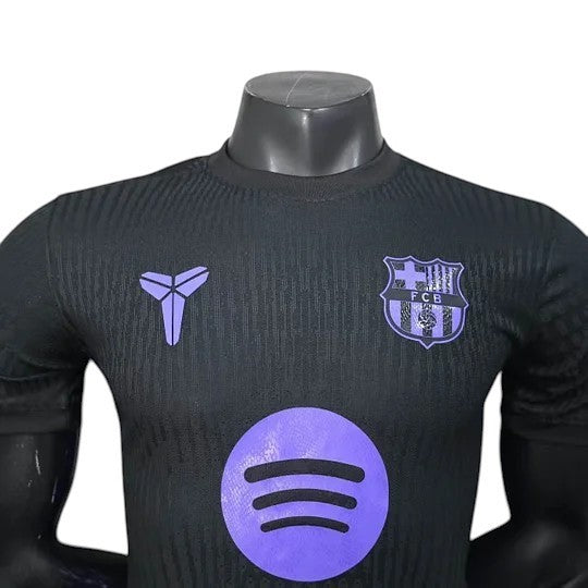 GOATkitz Barcelona 2025-26 black player version away jersey with purple accents and Kobe logo.
