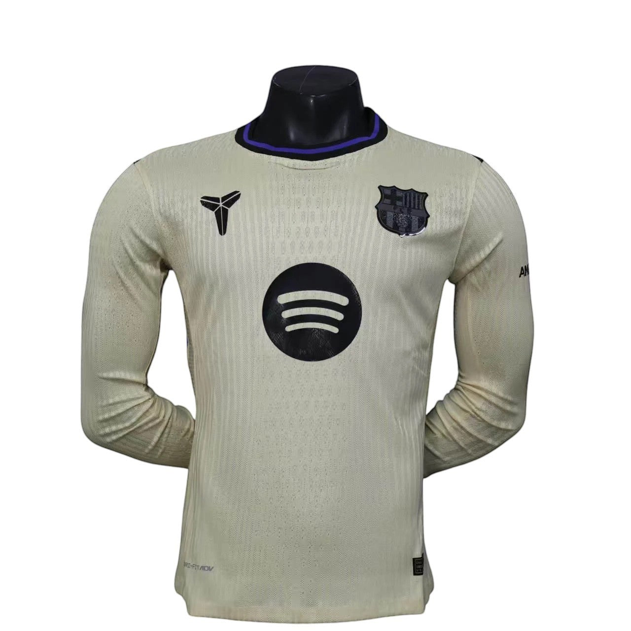 GOATkitz Barcelona 2025-26 adult player version away long sleeve jersey in cream with black accents and logos.