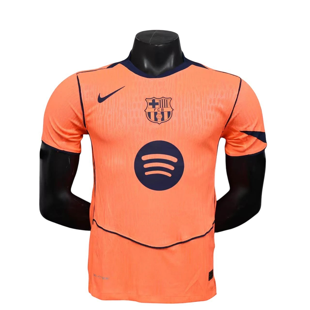 GOATkitz Barcelona 2025-26 adult player version third jersey in orange with navy trim and logos. Customizable.