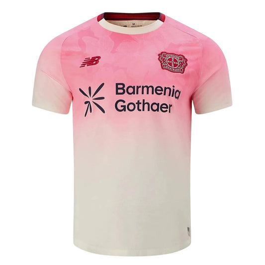 GOATkitz Bayer Leverkusen 2025-26 away jersey in pink and cream with gradient design, featuring team crest and sponsor logos.