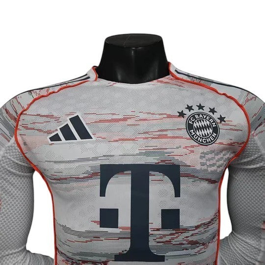 GOATkitz Bayern Munich 2025-26 white long sleeve player version jersey with red and blue abstract pattern and T-Mobile logo.