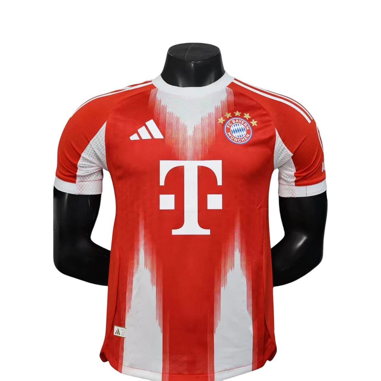 GOATkitz Bayern Munich 2025-26 adult player version home jersey in red with white accents and T-Mobile logo.