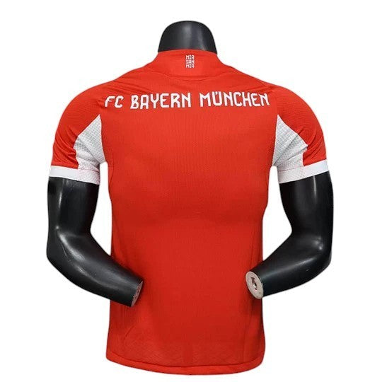 GOATkitz Bayern Munich 2025-26 red player version football jersey with white accents on sleeves and "FC BAYERN MÜNCHEN" text.