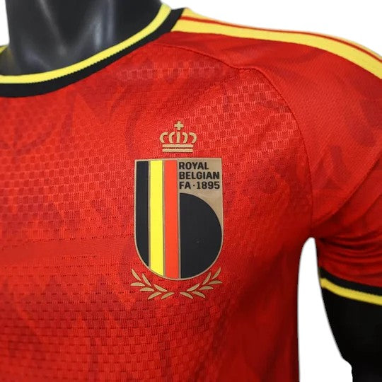GOATkitz Belgium 2026 player version home jersey in red with yellow trim and the Royal Belgian FA crest. Textured fabric.