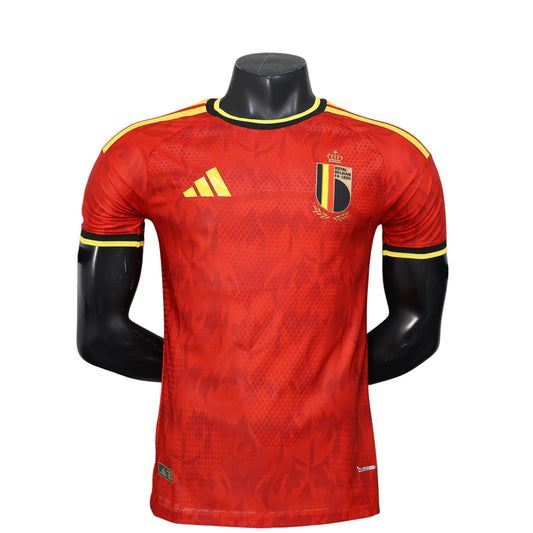 GOATkitz Belgium 2026 player version home jersey in red with yellow accents. Features crest and Adidas logo.
