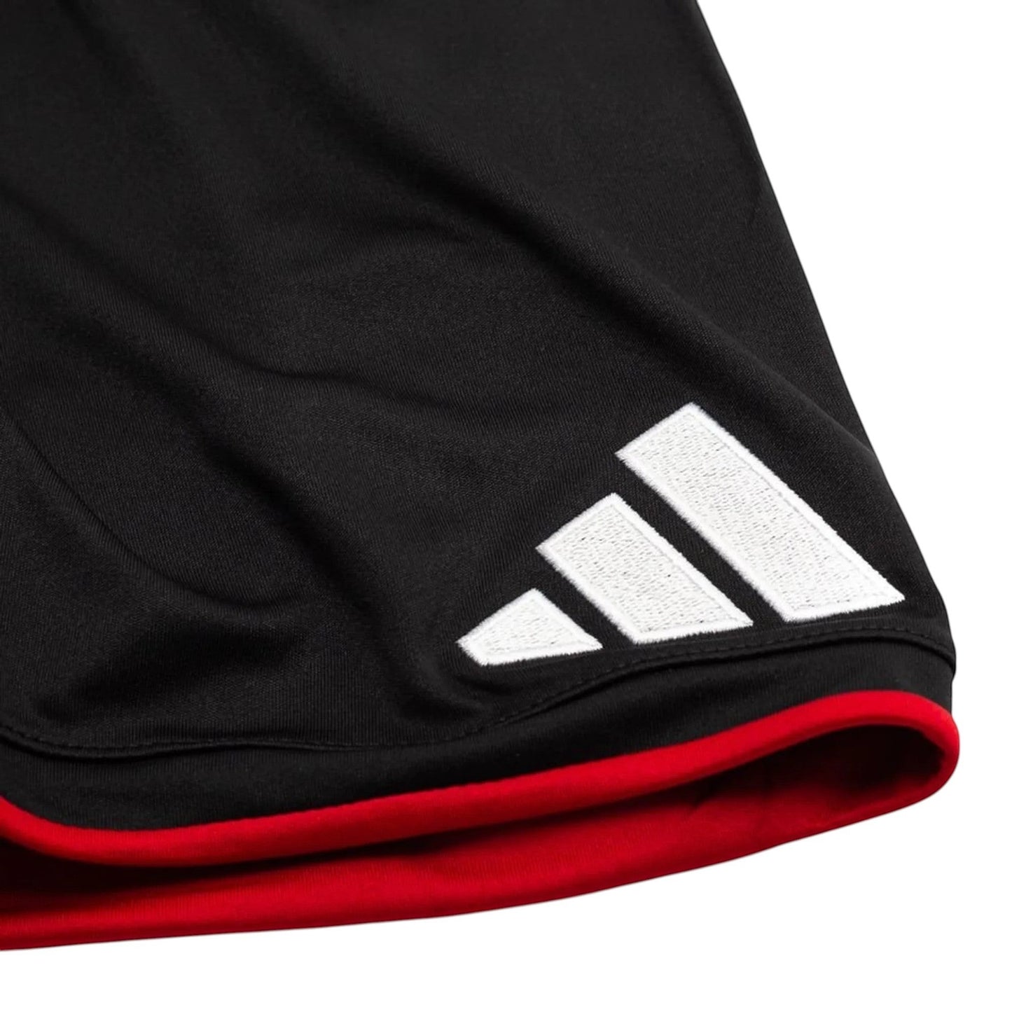 GOATkitz black kids' soccer shorts with red trim and white Adidas logo
