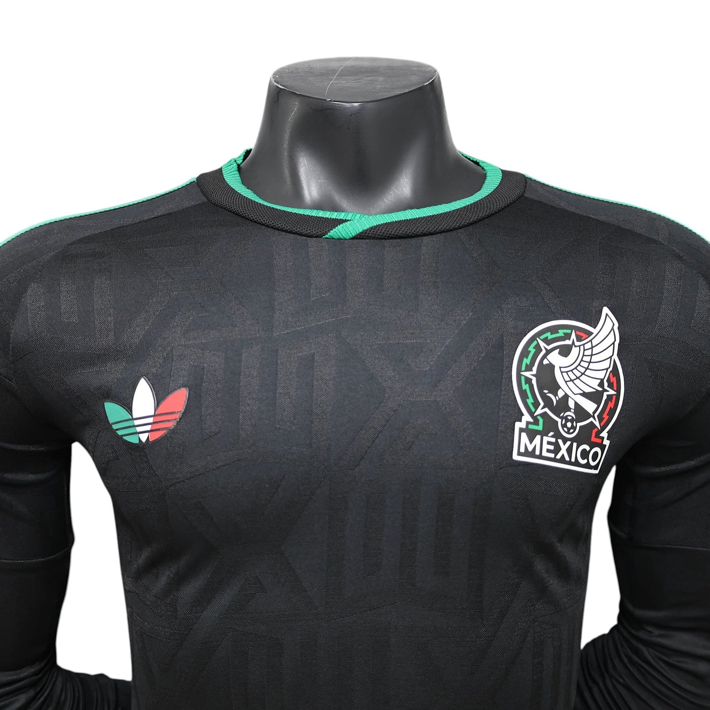 GOATkitz black long sleeve Mexico soccer jersey with green trim and embroidered crest. Features Adidas logo with Mexican flag colors.