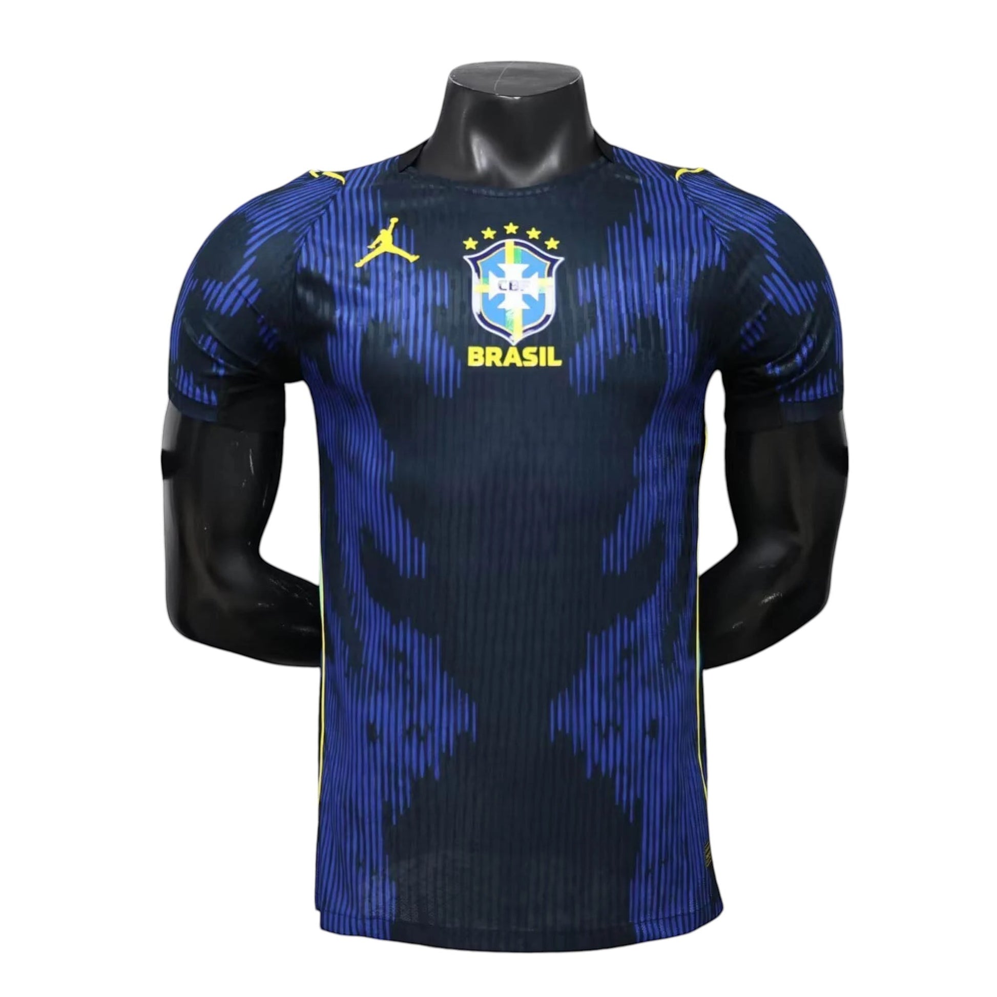 GOATkitz Brazil 2026 Player Version Away Jersey in navy blue with blue vertical stripe pattern and yellow accents. Features team crest and Jordan logo.