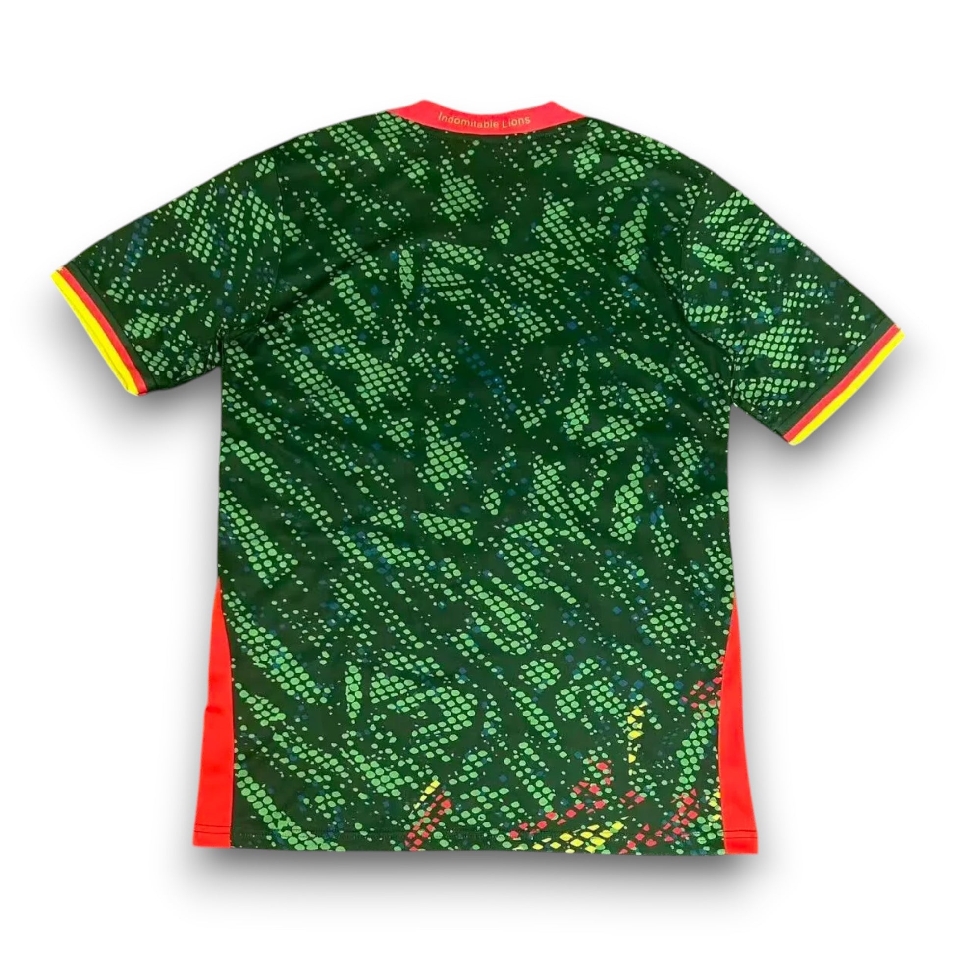 GOATkitz Cameroon 2026 adult home jersey, green with abstract pattern, red and yellow trim on sleeves and sides.