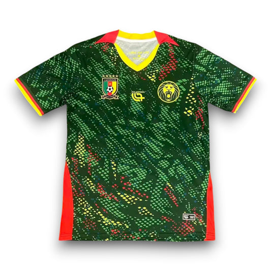 GOATkitz Cameroon 2026 adult home jersey in green with red and yellow accents. Features a V-neck, short sleeves, and a customisable design.