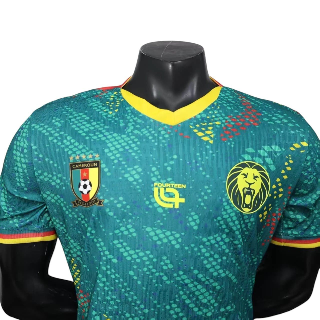 GOATkitz Cameroon 2026 player version home jersey in green with yellow trim, featuring the Cameroon crest and a lion logo.
