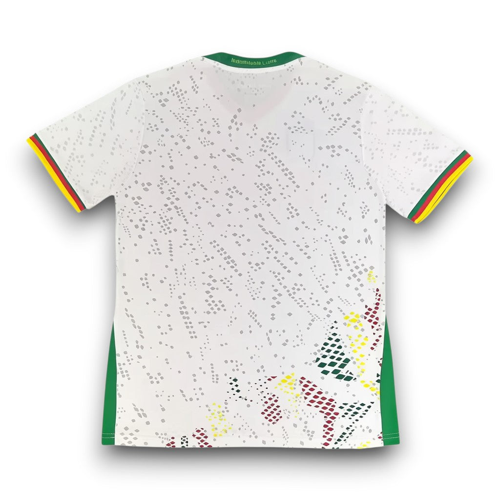 GOATkitz Cameroon 2026 adult away jersey, white with green, yellow, and red trim. Features a subtle diamond pattern and Cameroon flag colors at the hem.