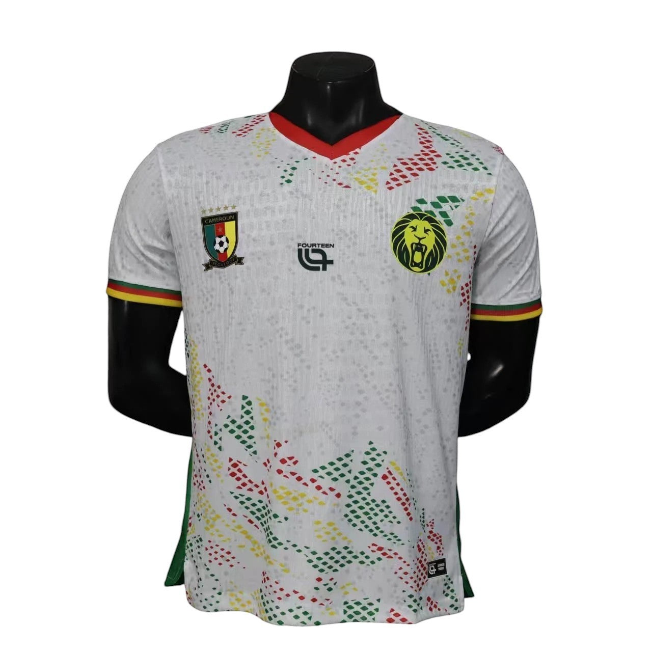 GOATkitz Cameroon 2026 player version away jersey in white with red, green, and yellow accents. Features the Cameroon crest and a lion emblem.