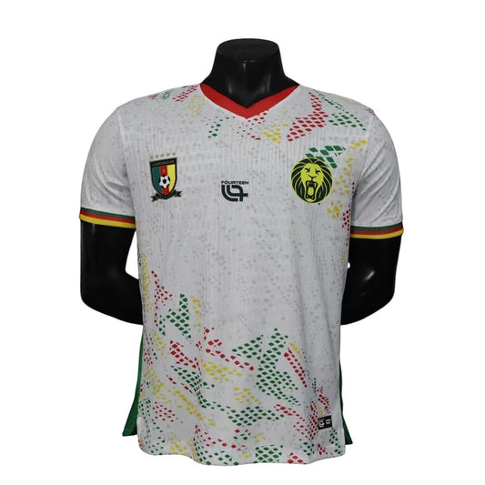 GOATkitz Cameroon 2026 player version away jersey in white with red, green, and yellow accents. Features the Cameroon crest and a lion emblem.